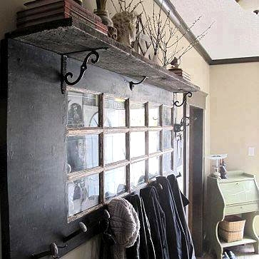 Recycled door as coat rack and photo/mirror frame