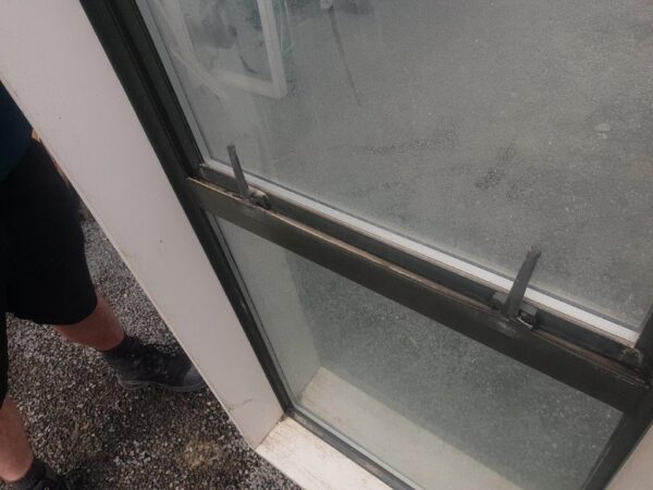 46204 Karaka DG Window close up of handles damage