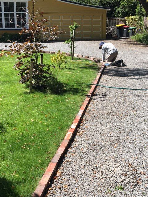 Recycled brick driveway lawn border construction