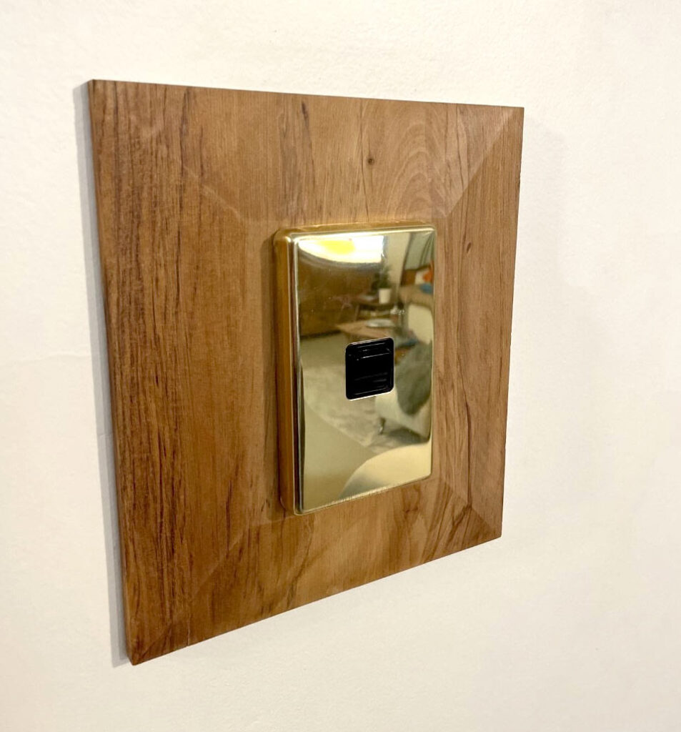 Recycled rimu light switch surround finger plate