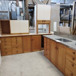 Rimu Galley Style Kitchen with Stainless Steel and Cream Top