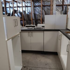 IMG_20260220_085618 White L Shape Kitchen with Island and Black Speckled Top