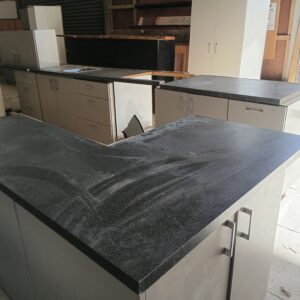 Fawn Galley Style Kitchen with Black Top